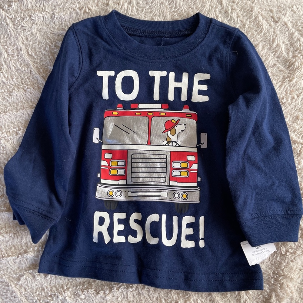 Carters long sleeve shirt. Never been worn; tags attached. 12 mo